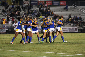 The CSUB women's soccer team celebrates after redshirt-freshman forward Aminah Settles scores a goal to put the Roadrunners up 2-0 in the second half against the Aggies at last year's Western Athletic Conference Tournament. Photo by Karina Diaz/The Runner