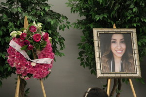 An arrangement of flowers and a photo of Elizabeth Ascencio adorned the memorial service hosted by Phi Sigma Sigma sorority. Photo by Alejandra Flores/The Runner