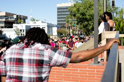 Participants of the protest give a moment of silence to all those who have died in recent shootings on Saturday, July 9. Photo by AJ Alvarado/The Runner 