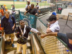 Outfielder Chantz Mack gives a fist bump to a Blaze fan following Monday, Sept. 12 game loss against the Visalia Rawhide at Sam Lynn Ballpark. Photo by Ben Patton/The Runner