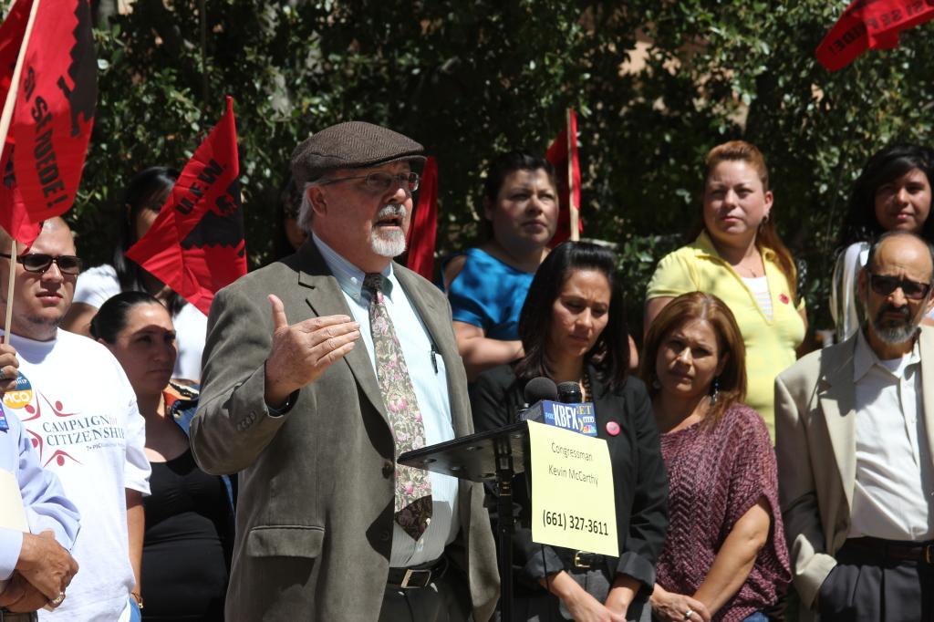 CSUB sociology professor, Gonzalo- Santos, who recently became a U.S. citizen, speaks about the new immigration reform bill outside of Congressman Kevin McCarthy's office Thursday, April 16. (Brian Willhite/The Runner) 