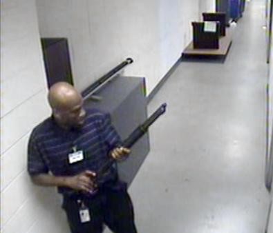 Image from abcnews.go.com
Aaron Alexis,34, (shown left) holds a shotgun as his rampage in a Navy yard shooting kills 13 and wounds 13 more on Mon Sept. 16.