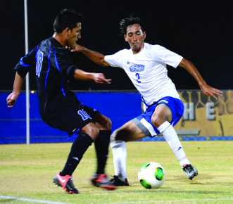 Photos by Abi Khan/The Runner
Freshman midfielder Jonathan Colunga evades a defender to get to the goal.
