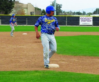 Senior shortstop Oscar Sanay stops at third base during practice on Friday, Jan. 24. Sanay led the 'Runners in most offensive statistics last season and looks to lead the team to a repeat of last year's great conference success.