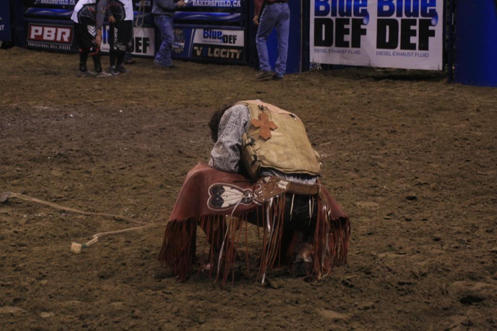 Rider takes a moment of silence after he was thrown off by the bull before the 8 second buzzer at Rabobank Arena in Bakersfield, Ca. this past Saturday, Nov, 22 for the Professional Rodeo.
Juana Martinez/ The Runner