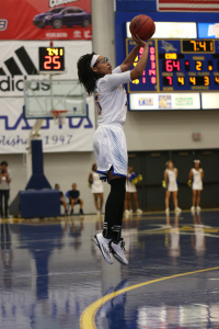 Redshirt-sophomore forward Erika Williams pulls up for a jumper against Utah Valley University at the Icardo Center on March 7. Photo by AJ Alvarado/The Runner