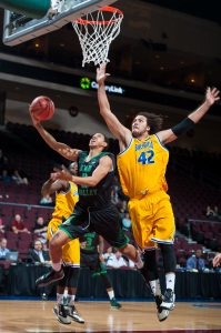 CSUB junior center Aly Ahmed goes up to block the shot of Utah Valley's junior guard Marcel Davis at the Orleans Arena on March 12. Photo courtesy of Mark Nessia.