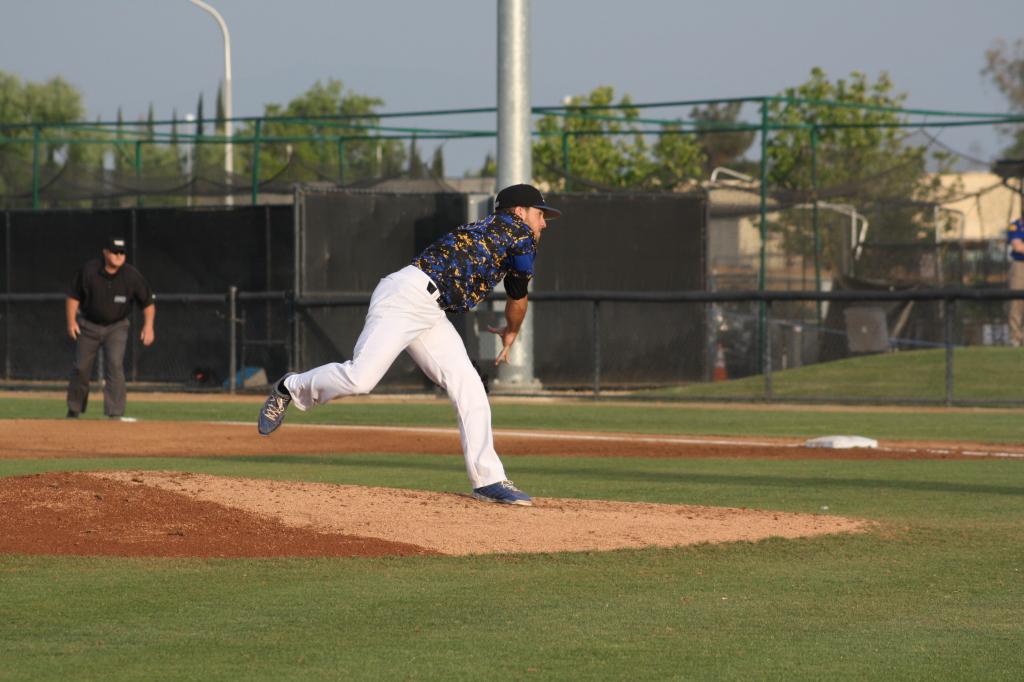 Hayden Carter, Senior, pitching to lead his team to victory on Friday, April 10 at Hardt Field. Karina Diaz/ The Runner