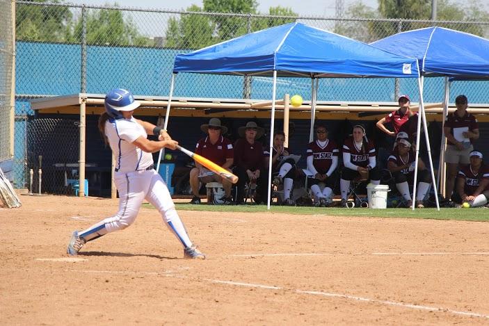 Sophomore infielder Karsyn Guzman hits the ball against New Mexico State University at the CSUB Softball Complex on April 17. 
Photo by Kabria Dodley/The Runner
