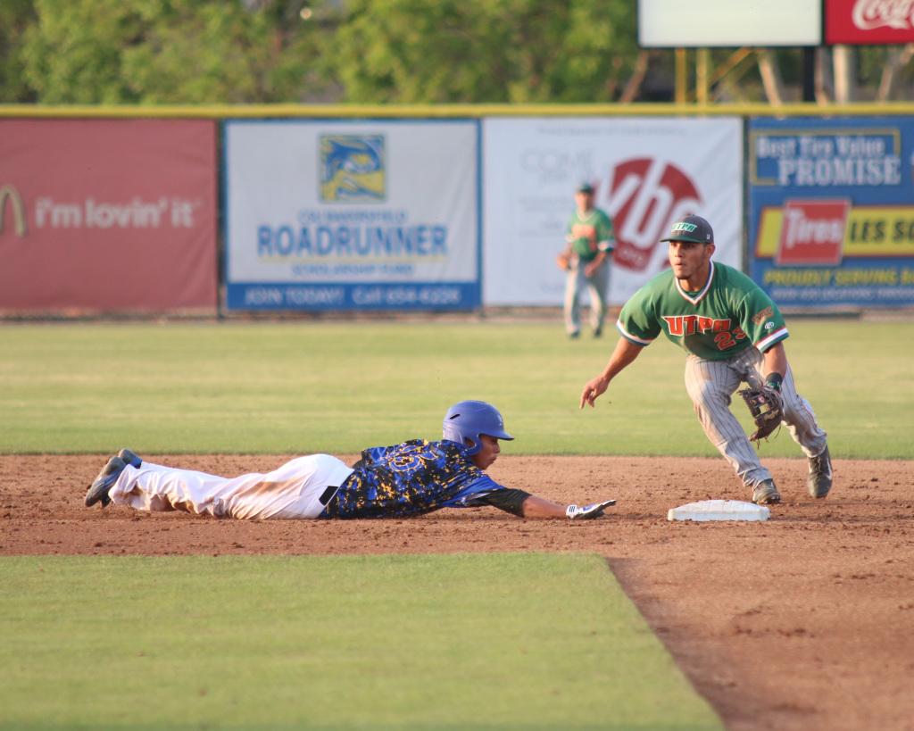 Sophomore David Metzgar dives safely back to the base on a pick off move from Texas Pan-American.