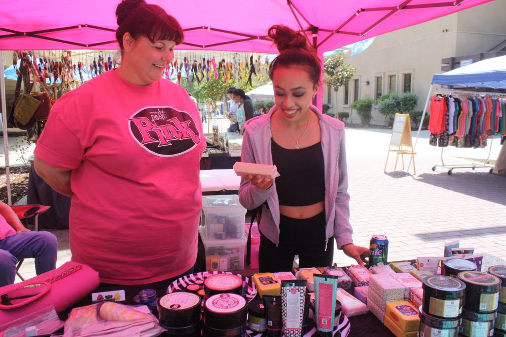 Kim Cook of Posh showing her products to Stephany Nguyen on Wednesday, May 6 on the Redbrick road