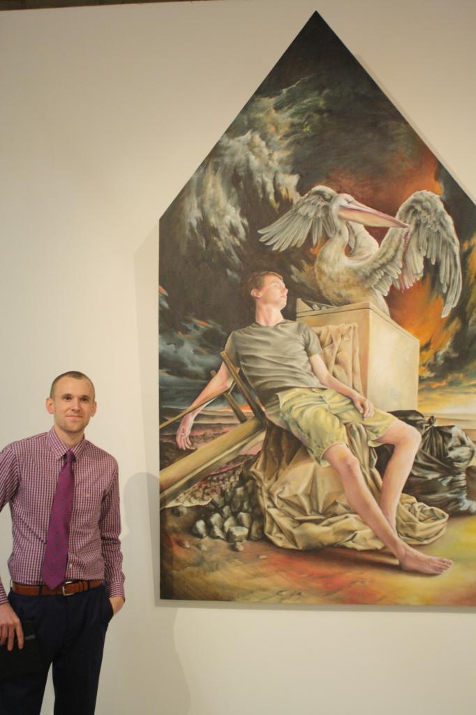 Luke Boyd smiling prod for her work "Untitled" during the opening of Nexus senior art exhibition on Thursday, May 14 at Todd Madigan Gallery
