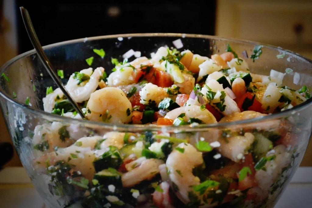 Senior Columnist Alex Ripepi prepares a Ceviche dish on May 2, which included ingredients such as tomatoes, cilantro, onions, garlic, jalapenos, shrimp, lemon and salt.
Photo by Marisel Maldonado/The Runner 
