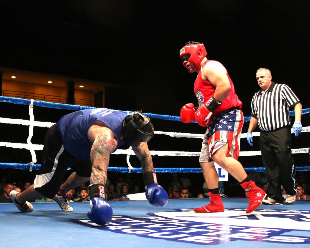 Tim King Jr. KCSO(right) watches as his opponent falls to the ground after he landed a hard punch to the head of Steven Turney (left) KCSO. AJ Alvarado/The Runner