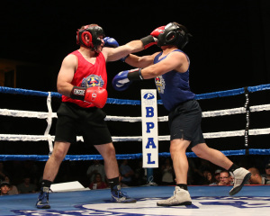 Sergio Lopez US Army (left) lands a straight left on Joey Bravo (right) of the CHP.