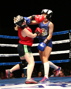 Tabitha Tourula (let) US Army exchanges punches with Lorena Perez (right) BPD during their bout at the Battle of the Badges.