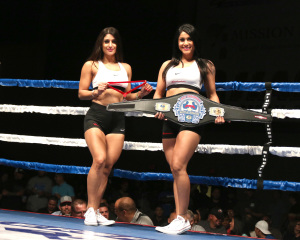 The ring girls for the Battle of the Badges, Rosa Valdez (left) and Mayra Valdez (right).