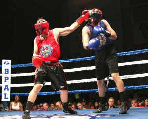 Juan Gutierrez KCPD(left) lands a left hook to the head of Nick Childers (right) BPD during their bout at the Battle of the Badges.