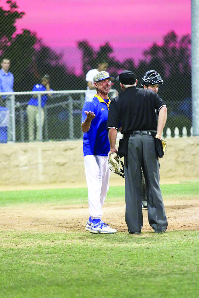CSUB baseball coach Bill Kernen sticks up for his player and argues a call with an umpire in a game against Cal Poly at Hardt Field on April 24.
Photo by AJ Alvarado/The Runner