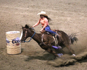 Samantha Lyne out of Cotulla, Tx almost went down but her horse was able to maintain its foot and she completed the barrel circuit at the 2015 Sherriff’s stampede rodeo on Friday May 1, at the Kern County Fairgrounds.