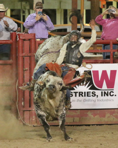 Canechito Torrez Ortega from Lompoc, Ca falls short of riding a bull named Doughie Fresh at the 2015 Sherriff’s stampede rodeo on Friday May 1, at the Kern County Fairgrounds AJ Alvarado/ The Runner