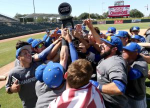 CSUB holds up its WAC Tournament Championship after the 5-4 win over Seattle on May 24. Photo by Darryl Webb/WAC
