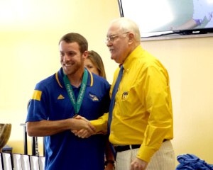Senior pitcher Hayden Carter receives his Medal of Appreciation from Mayor Harvey Hall in the Icardo Room on June 11.