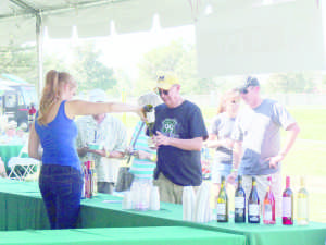 8.Some audience members wait in line and some get wine poured into their cup at the Highway 99 Musical Festival on Oct. 10.