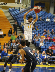 Redshirt-freshman guard Damiyne Durham dunks the ball against San Diego Christian College on Saturday, Nov. 14 in the Icardo Center. Photo by Marisel Maldonado/The Runner