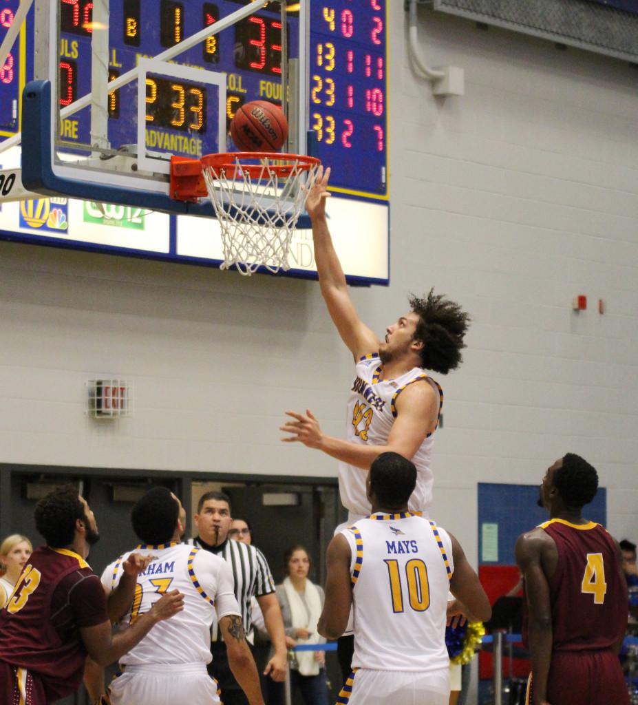 Senior center Aly Ahmed scores against Bristol in an exhibition game on Nov. 7.
Photo from The Runner Archives