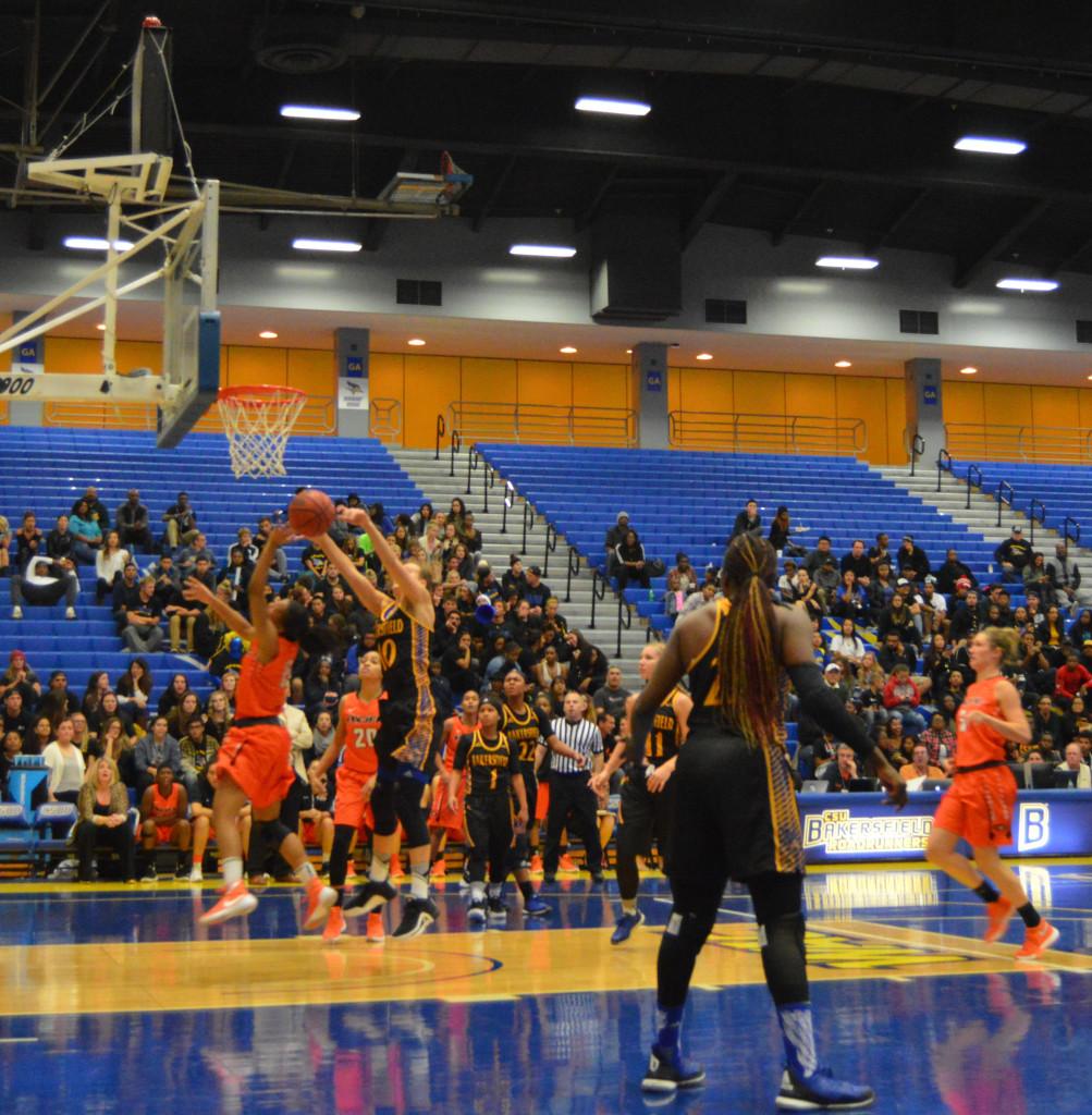 CSUB's redshirt-junior guard Keri Kleist blocks the shot of Pacific player on Friday, Nov. 13 in the Icardo Center.
Photo by Nick Fequiere/The Runner