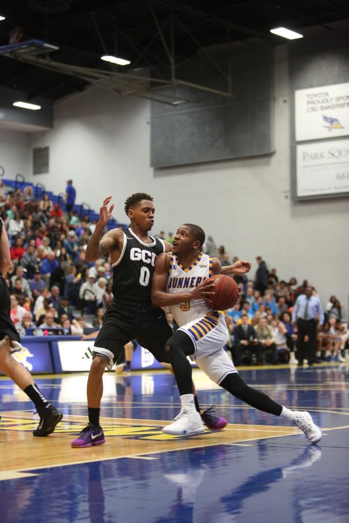 CSUB junior guard Dedrick Basile drives to the basket against Grand Canyon on Saturday in the Icardo Center.
Photo by AJ Alvarado/The Runner