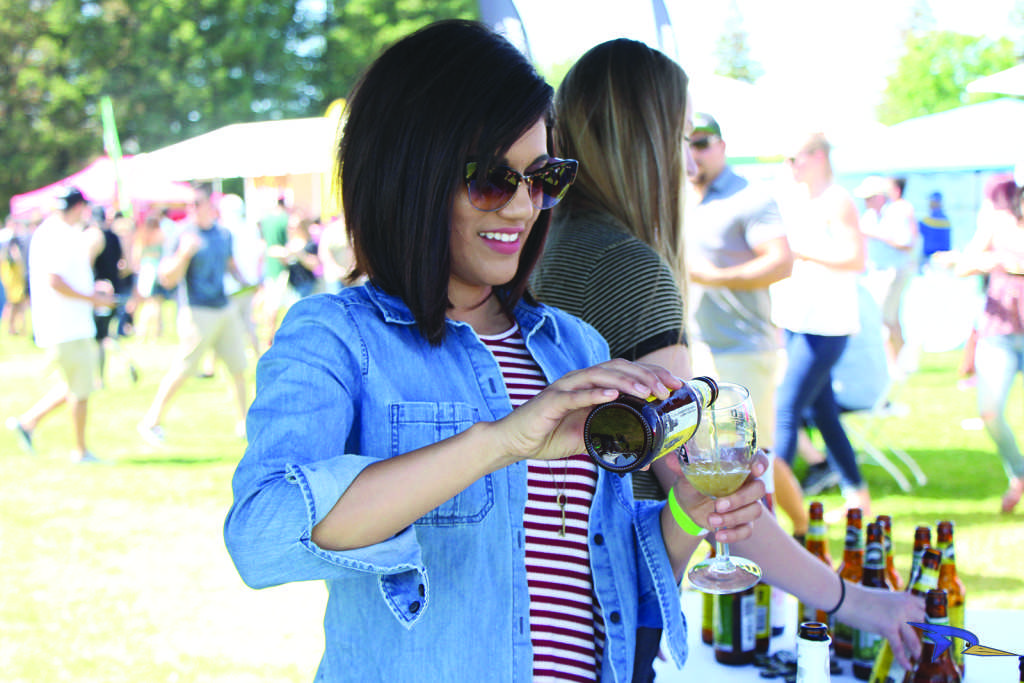 Nikki Sanchez, a volunteer, helped serve Goose island craft beer at the 3rd annual Mac and cheese festival hosted at CSUB’s Alumni Park on Saturday April 16. 
