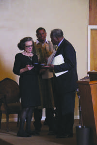 Marla Wynn Mudar Iyasere alongside her son Solomon O. Iyasere, Jr. and CSUB President Horace Mitchell at the memorial service for the late CSUB professor.