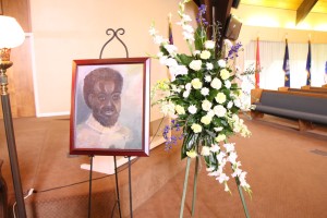 A portrait of Solomon Ogbede Iyasere created by one of his students as a gift for his family adorned the memorial service on April 9. Photo by Alejandra Flores/The Runner