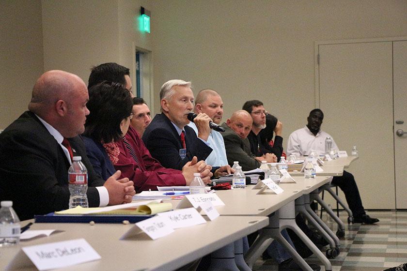 Mayoral candidate Alex Merrill addresses a question asked at the debate in Student Housing Multi-purpose room on Thursday. Photo by James Chavez/The Runner
