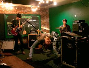 Bassist Scott Jones bends back while playing bass at Sandrine's Italian and Basque Restaurant and Bar. Picture taken by Tylorae Cardenas on July 16, 2016.