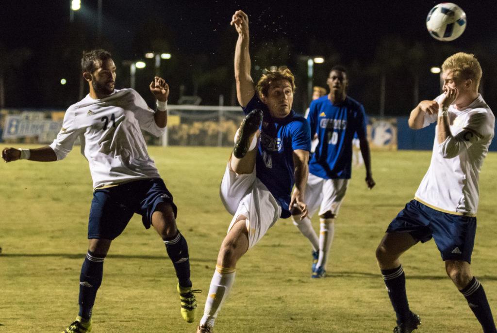 1.	CSUB’s junior forward Louis Lapouge fights for the ball against UC Davis’ junior defender Greg Salazar and junior midfielder Noah Wilson in the first half on Thursday, Sept. 15th at CSU Bakersfield.

