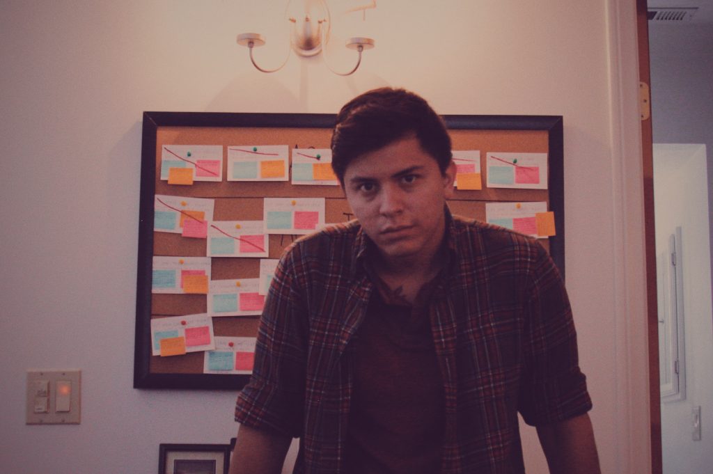 A profile picture of Mark Federico Moreno, standing in front of his script board. Picture courtesy of Mark Moreno. Taken October 1, 2016.