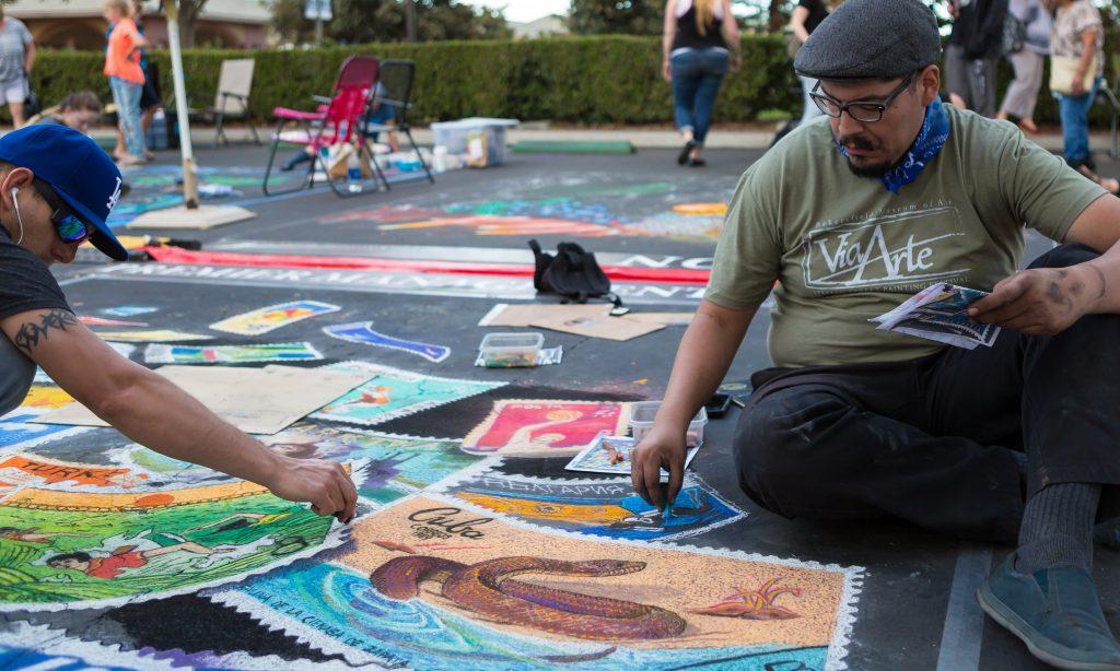 Carlos Fierros works on "The Sanctity of Water as revealed through Postage Stamps from Around the World."
Ben Patton/The Runner