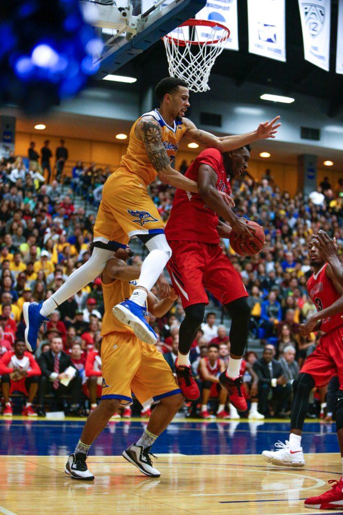 CSUB's guard Damiyne Durham and a Fresno State player battle for a rebound Nov. 22. Photo by AJ Alvarado/The Runner