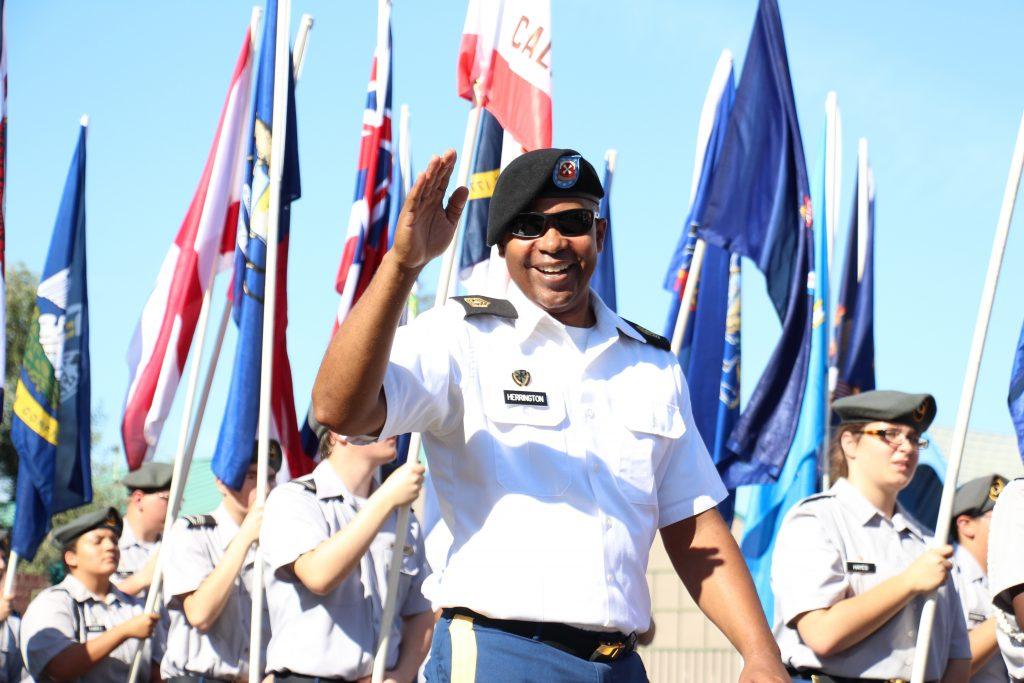 A U.S. veteran waves at the people in attendance during the parade Friday, Nov. 11 in downtown Bakersfield. 
Photo by Alejandra Flores/The Runner