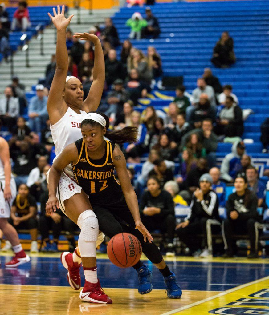 CSUB guard Alexxus Gilbert attempts to drive around Stanford's Dijonai Carrington at the Icardo Center on Thursday, Dec. 1. No. 11 Stanford beat CSUB 77-56.
Photo by Ben Patton/The Runner
