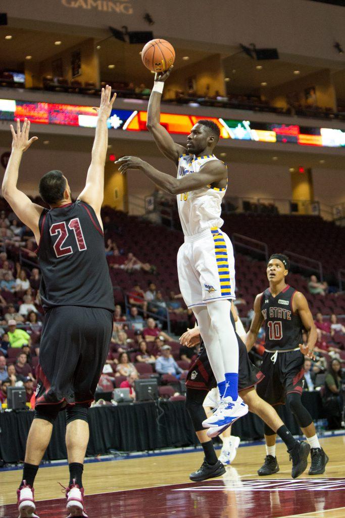 Junior center Fallou Ndoye  goes up for a baby hook against New Mexico State Saturday, March 11.
