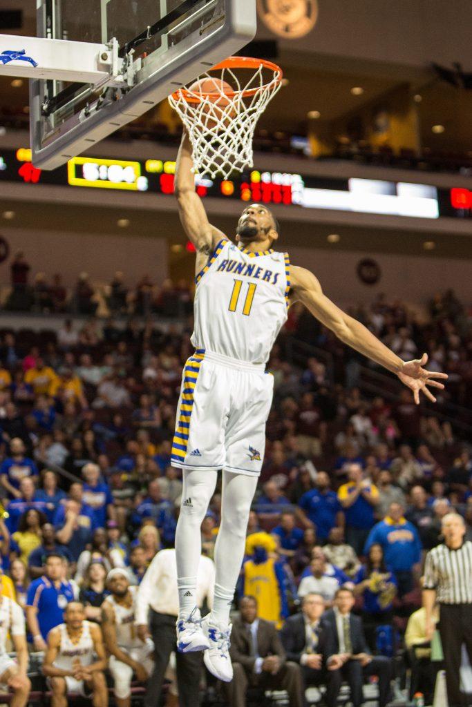 Redshirt-senior Jaylin Airington goes up for a dunk against New Mexico State. Airington scored 12 points. Photo by AJ Alvarado/The Runner