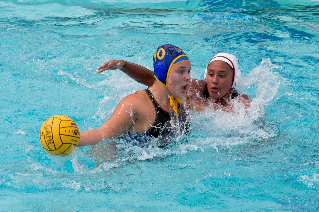 Junior utility player Cassandra Ream drives past an Arizona State defener in a game at Hillman Aquatic Center on Saturday, March 18.
