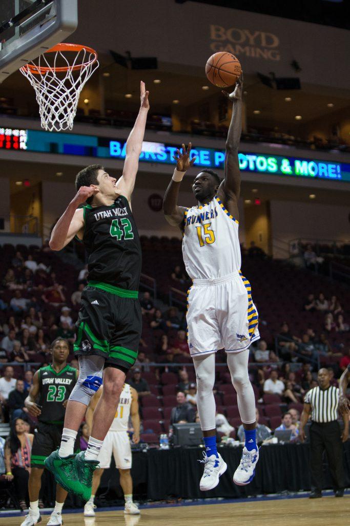 CSUB's center Fallou Ndoye goes up for a jump hook late in the game against Utah Valley's ceter Andrew Bastien. Photo by AJ Alvarado/The Runner
