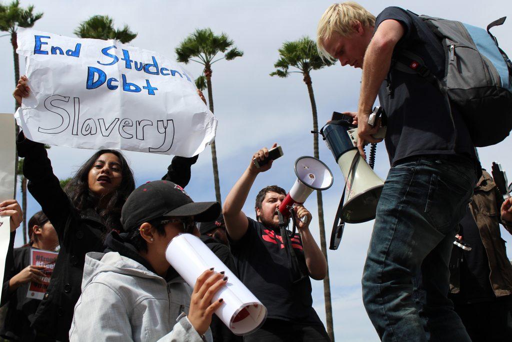 Student protesters chant outside the Office of the Chancellor in Long Beach, California on March 22, 2017. 
Photo courtesy of Matthew Teel/The Daily 49er at CSU Long Beach. 