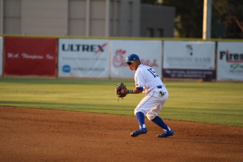 Senior infielder David Metzgar sets to throw a runner out at first after he fields a ball at Hardt Field. Metzgar currently has a 22-game hitting streak at the plate as well. Photo by Trevante Hammonds/ The Runner 
