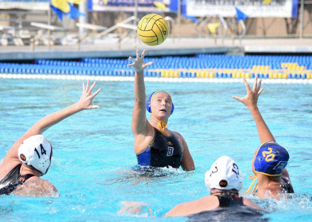 Junior year player Jada Helberg attempts to set up a teammate with a pass during a match in the 2017 season. It was the final season for water polo at CSUB. Photo by Simer Khurana/ The Runner 